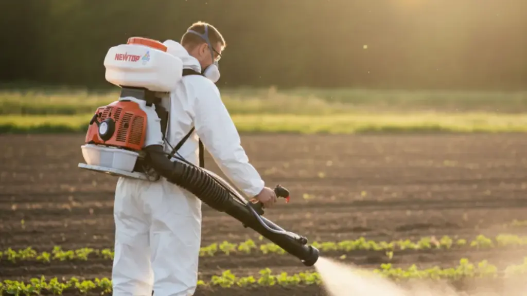 Farmer using a NEWTOP motorized backpack sprayer in fields