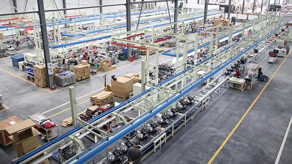 Elevated overview of a spacious modern factory assembly line production facility