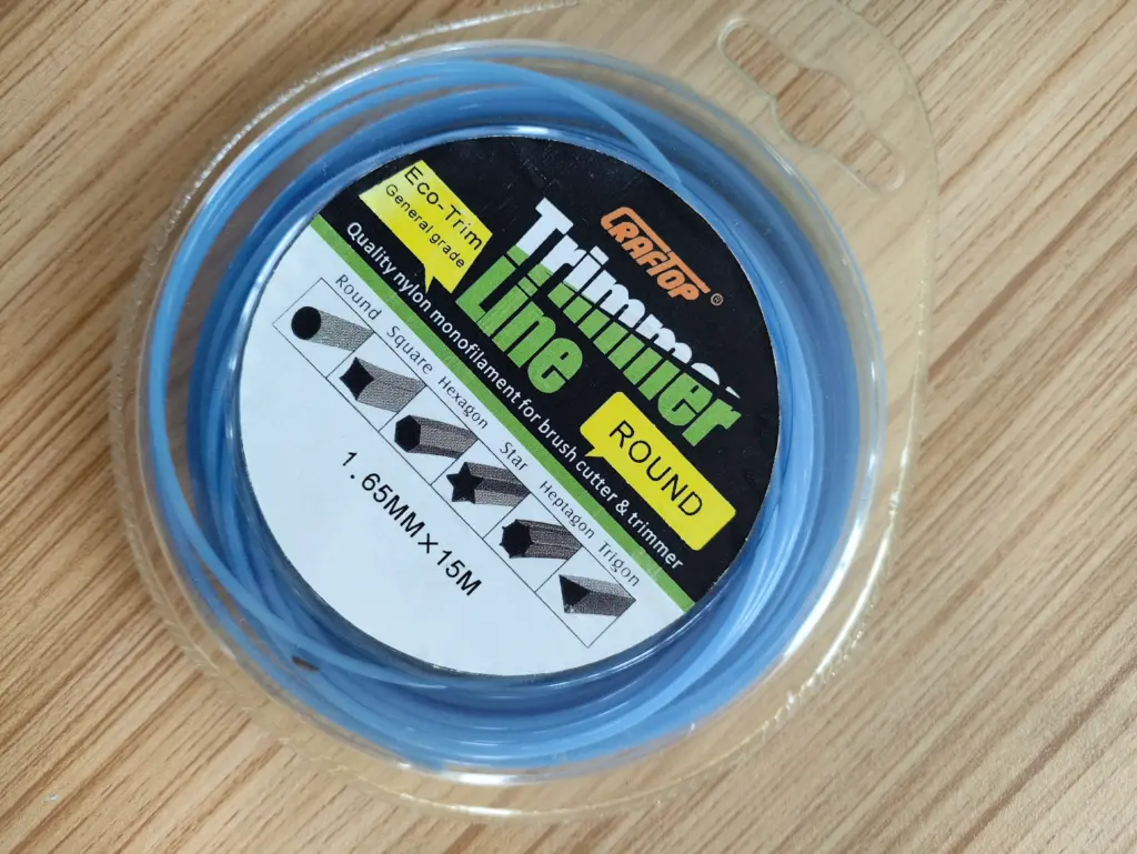 Blue round trimmer line spool in clear packaging, 1.65mm diameter x 15m length for brush cutter and weed trimmer